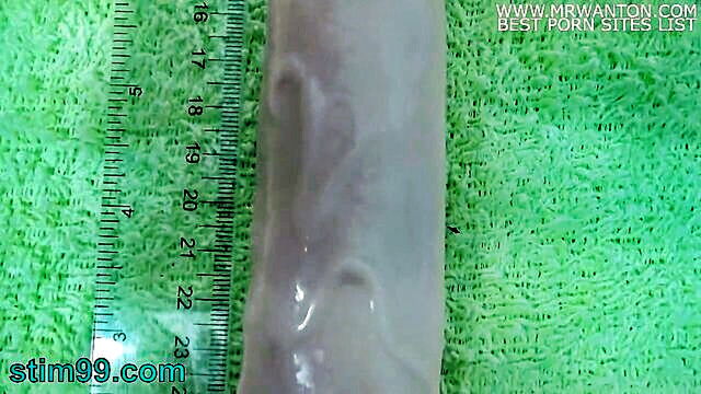 older woman using a giant dildo to penetrate her urethra and anal beads for stimulation : Stim 99