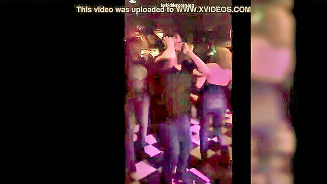 her, show, milf - a matronly woman bares her chest at a live music event