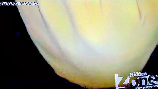 sexy blonde voyeur captures shots of a tanned babe in tight jeans