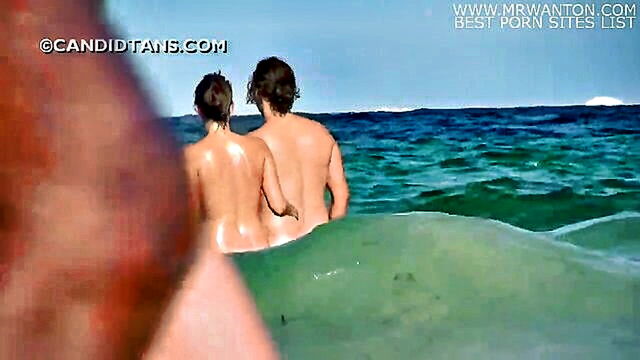 bath, couple, voyeur - a voyeur witnesses a naked couple bathing in the sea