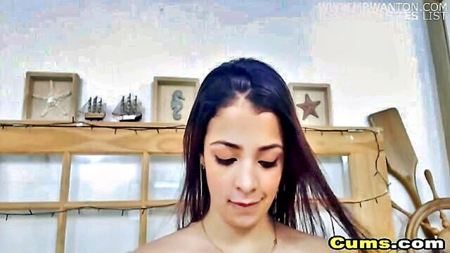 a curvy latina with perky breasts indulges in solo play on camera : webcam