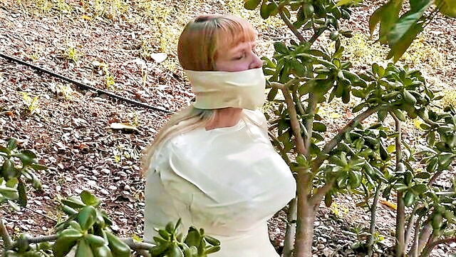 big tits, brunette, fetish - newly mummified and bound with microfoam tape in an erotic bdsm scenario