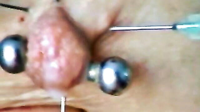 bdsm with brunette using needle for extreme pleasure