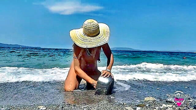 horny mature milf flaunts pierced nipples and multiple piercings at a nude beach : FapHouse