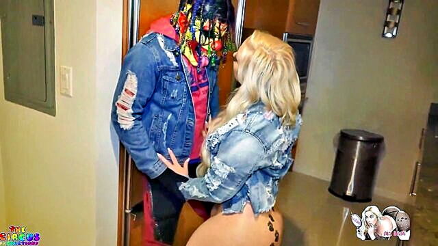 Mz Dani - a blonde woman receives a blowjob from a clown Mz Dani