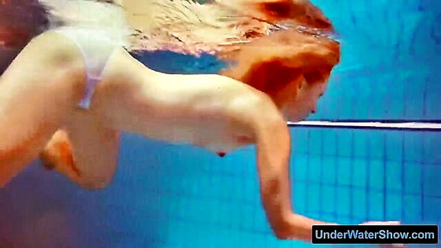 redhair babe in a white dress & swimsuit gets wet & wild : lesch_bernice
