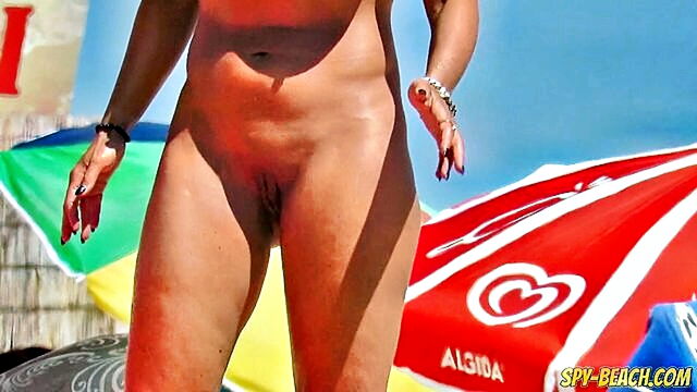 nude beach, beach voyeur, nudist - amateur milf espousing nudity at the beach   intimate view of mature pussy