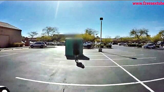 busty blonde gives a blowjob to a gloryhole in a public toilet