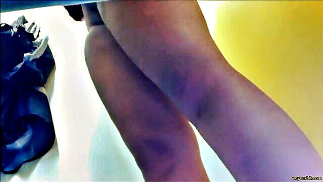 amateur beauty gets naughty in front of changing room spy cam