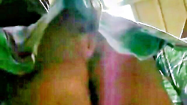 a thrilling encounter with a firm and round derriere partially exposed through pink undergarments in a public setting