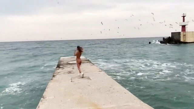 lesbian porn, public, porn video - gormless Russian girl on the beach