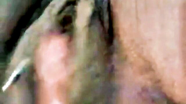 labia, black, masturbate - a woman indulges in self pleasure by stimulating her large plump clitoris